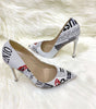 Schuhe mit spitzer Spitze und Pfennigabsatz